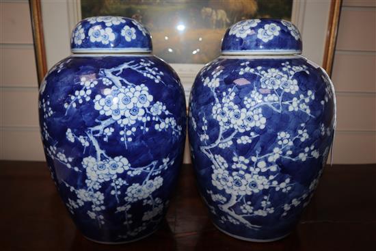 A pair of Chinese blue and white jars and covers, c.1900, Kangxi mark (one a.f.)